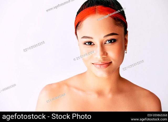 Portrait of smiling pretty african american woman on white background with copy space. Fashion concept, female beauty