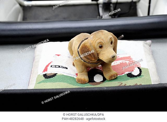 A dashboard dog on a cushion in an Isetta during ""Drive it Day"" in Cologne,  Germany, 27 April 2014. Classic car owners can drive and show off their cars in...