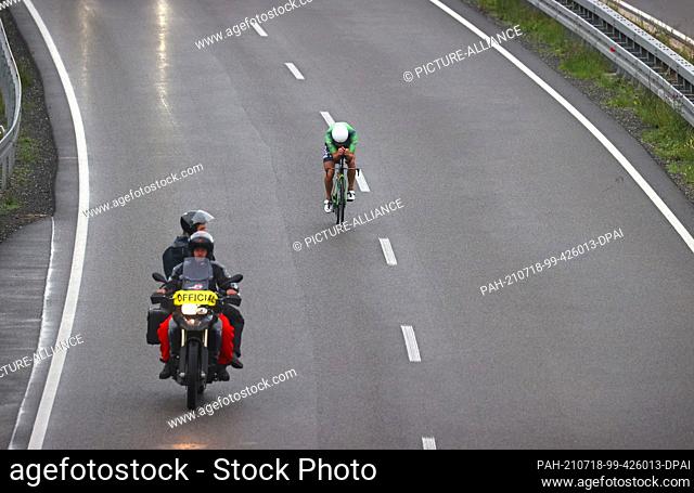 18 July 2021, Bavaria, Immenstadt: Lionel Sanders, triathlete from Canada, rides his bike on Federal Highway 19 during the Tri Battle Royal