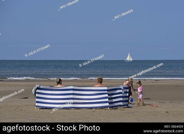 Families enjoying the summer sun on beach in Wales 'staycation' after lockdown easing due to Coronavirus, Covid-19 pandemic, Ynyslas , Dyfi estuary, , Borth