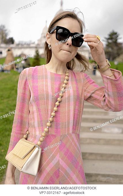 fashionable blogger woman in front of touristic sight Basilica Sacré-Cœur, during fashion week, in city Paris, France, in city Paris, France