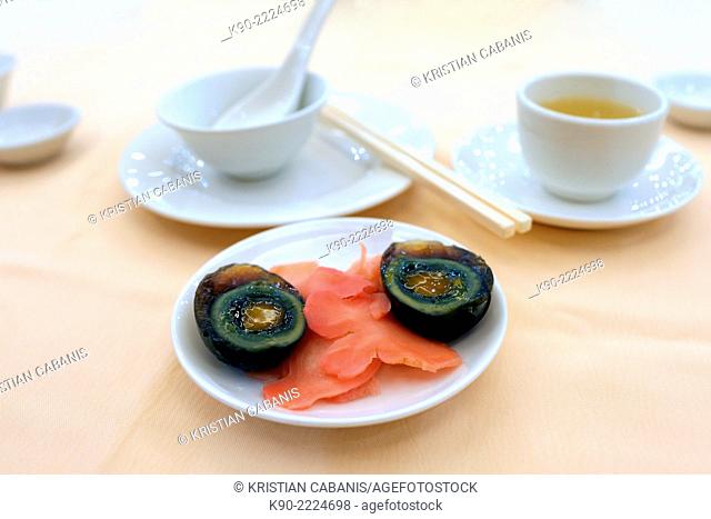 Onethousand years old eggs with ginger on a plate in a chinese restaurant, Central, Hong Kong, China, East Asia