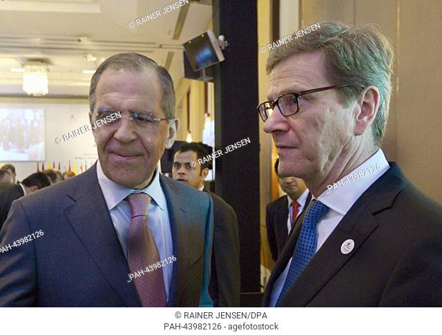 German Acting Foreign Minister Guido Westerwelle (R) talks to Russian Foreign Minister Sergei Lavrov during the 11th Asia-Europe Meeting (ASEM) Foreign...