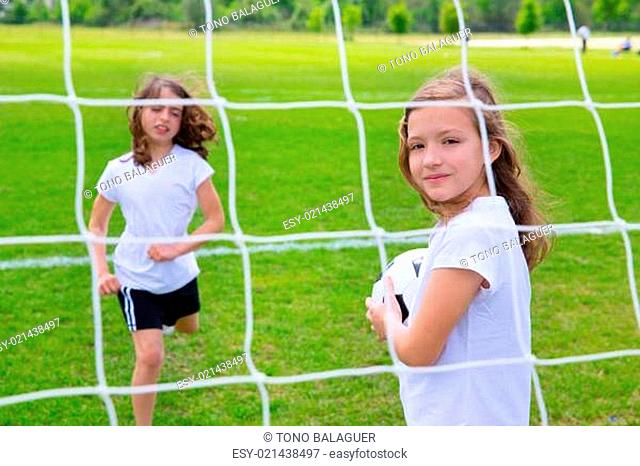 Soccer football kid girls playing on field