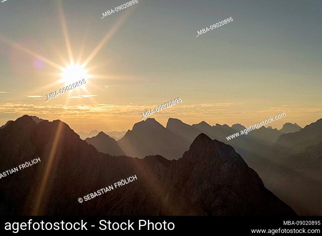 Sunrise taken from the west Karwendelspitze, sun star behind the Wörner