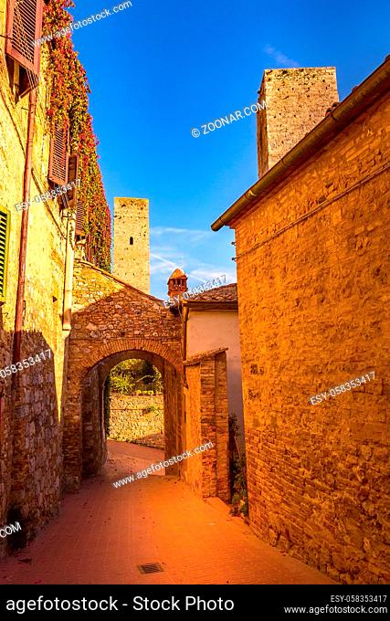San Gimignano, Tuscany, Italy arch, old medeival street in typical Tuscan town, popular tourist destination