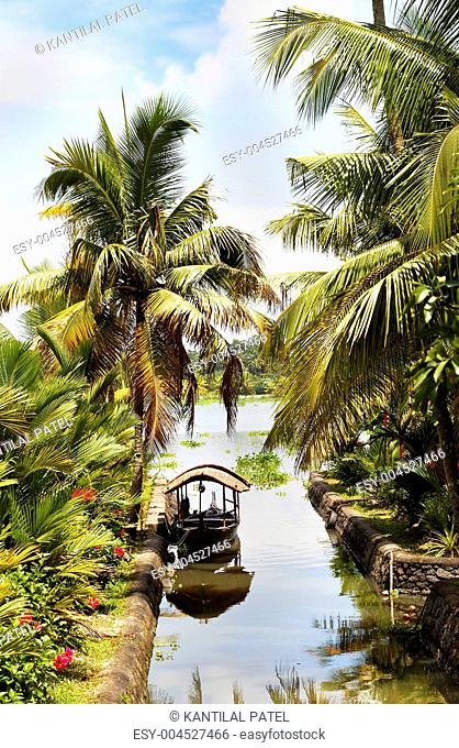 Canal scene taxi boat Kerala backwaters India