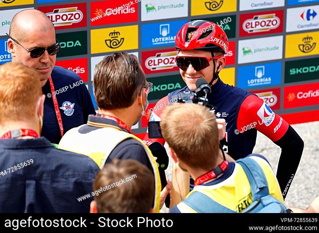 Belgian Remco Evenepoel of Soudal Quick-Step, wearing the red jersey of the leader in the general ranking, talks to the press at the start of stage 4 of the...