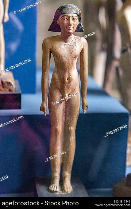 Cairo, Egyptian Museum, statuette of Iby, in wood. He's shown as a young boy, naked, with a wig