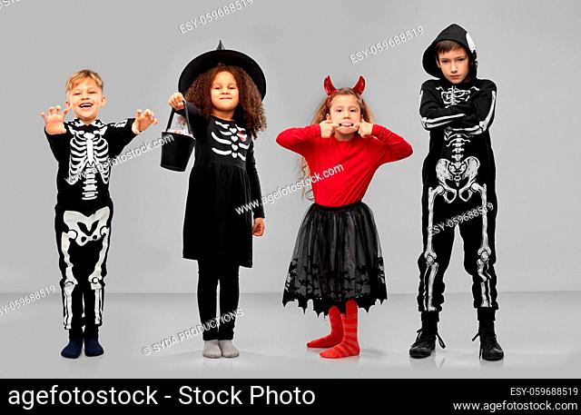 children in halloween costumes trick-or-treating