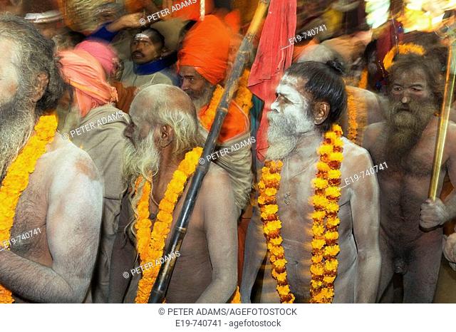 Naga Sadhus preparing for bathing in The holy river Ganges at Kumbh Mela Festival. Allahabad, Uttar Pradesh, India