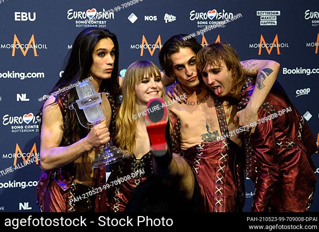 23 May 2021, Netherlands, Rotterdam: Guitarist Ethan (l-r), bassist Victoria, singer Damiano and guitarist Thomas of the band ""Maneskin"" (Italy) rejoice after...