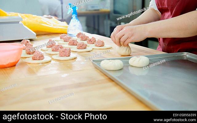 The process of making bakery products with hands close-up