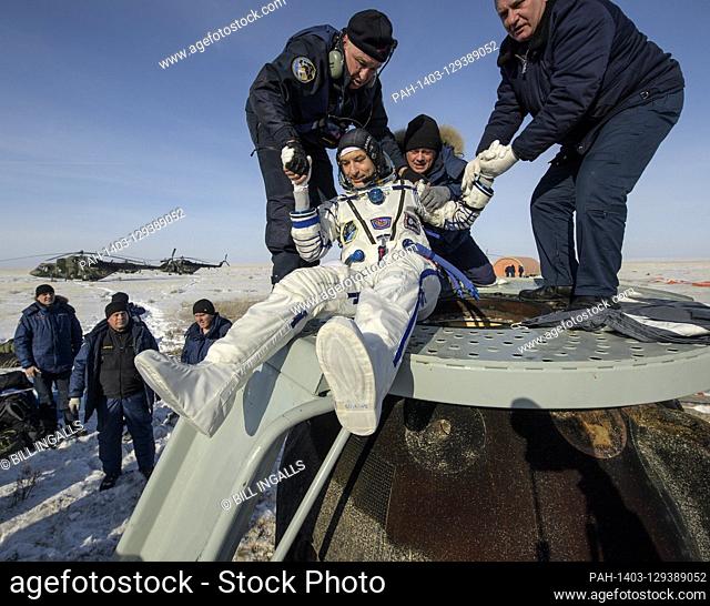 ESA astronaut Luca Parmitano is helped out of the Soyuz MS-13 spacecraft just minutes after he, NASA astronaut Christina Koch