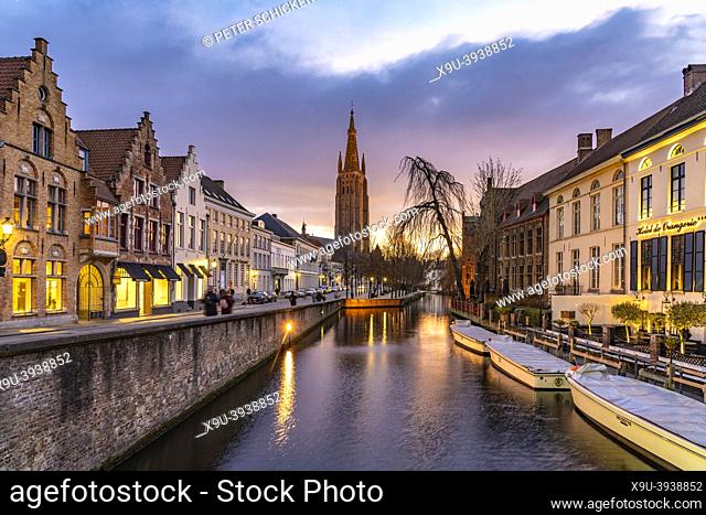 Canal and Church of Our Lady at dusk, Bruges, Belgium, Europe