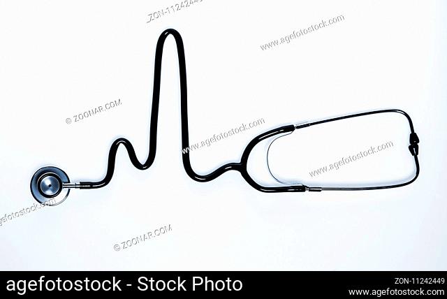 Stethoscope in the shape of heart beat isolated on a white background