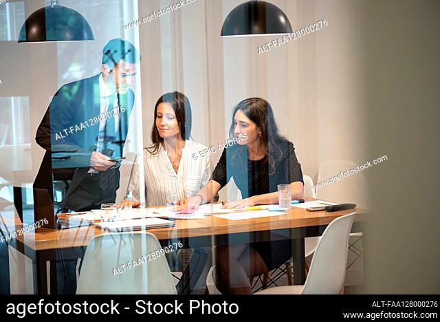Business people working together in board room