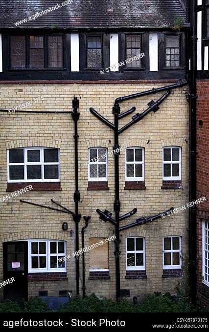 Road network of gutters on a typical English house wall