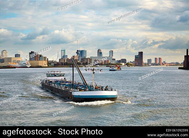 Cargo ship with Rotterdam skyline in the background