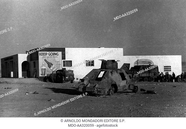Water supply on the way to Tobruk. Armoured vehicles destroyed in front of the roadhouse called White House, 28 km upstream of Tobruk; in the background