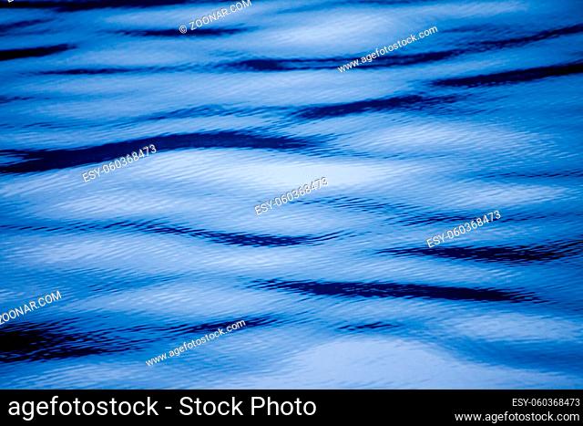Blue abstract of ripples and waves on the surface of water