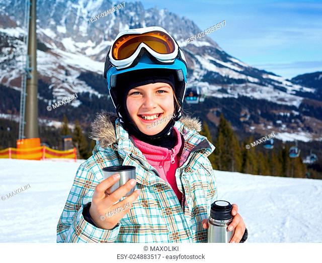 Ski, skier, winter. Lovely girl has a fun on ski - resting and drinking tea