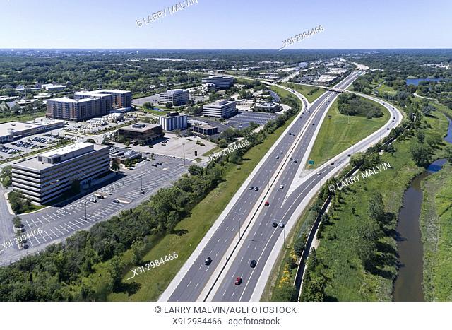 Aerial view of a highways, overpasses, ramps and buildings in a suburban Chicago suburban setting. Northbrook, IL. USA