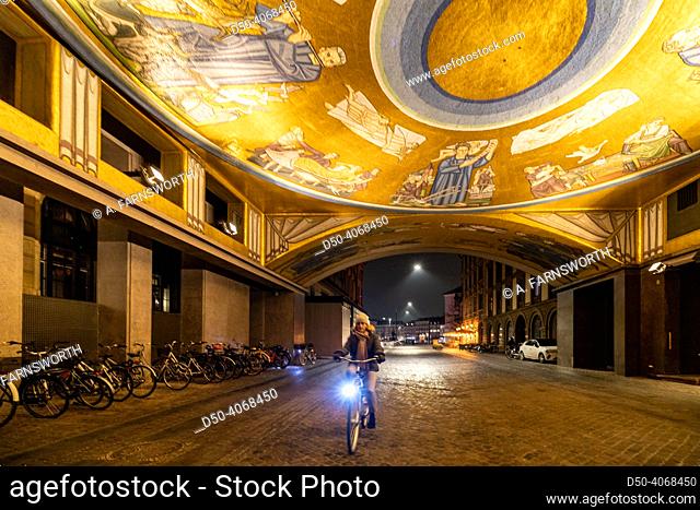 Copenhagen, Denmark A woman bicyclist at the August Bournonvilles Passage at the Stærekassen theatre