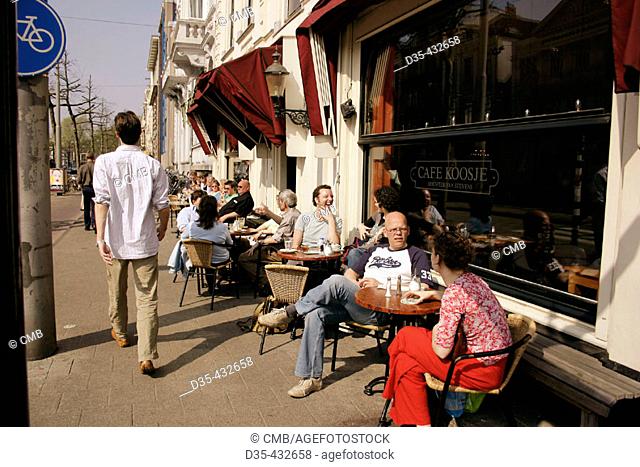 People sitting in street café