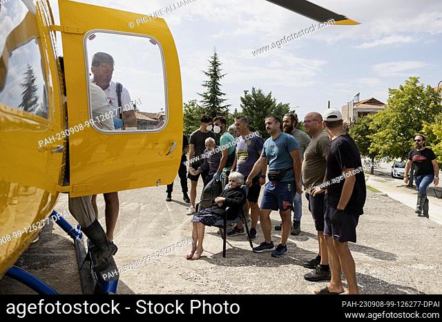 08 September 2023, Greece, Karditsa: Residents wait for transport by rescue helicopter in the village of Palamas near the town of Karditsa