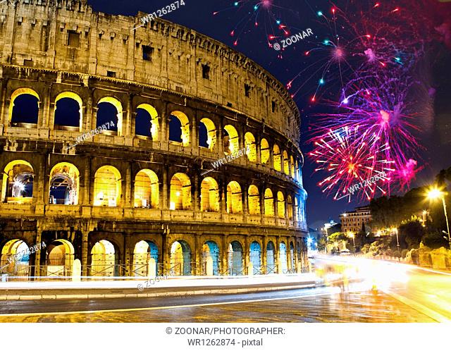 Celebratory fireworks over Collosseo. Italy