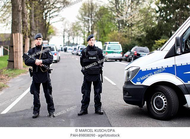 Police officers secure a street in Dortmund, Germany, 12 April 2017. Three explosions occurred near the road blockade next to the team bus of the Borussia...