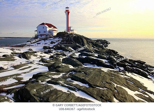 Winter scene with snow at Cape Forchu Lighthouse in Nova Scotia in Canada