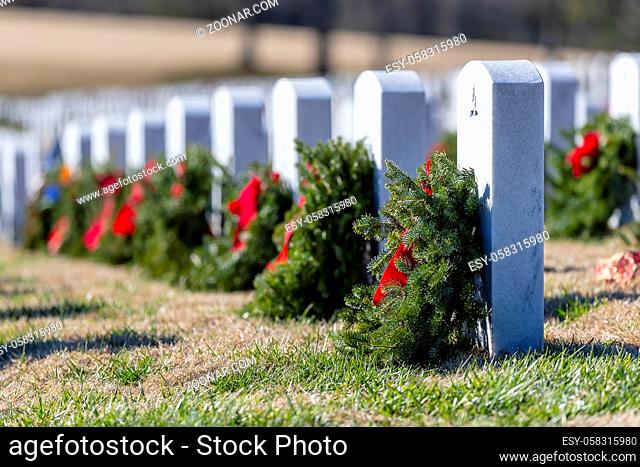 Veterans cemetery adorned with wreaths for the holiday season