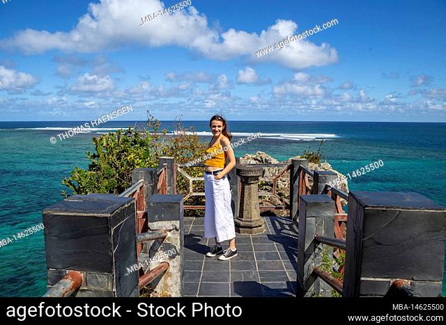 Young lady at Maconde view point. Famous road curve in the south of Mauritius island, Africa