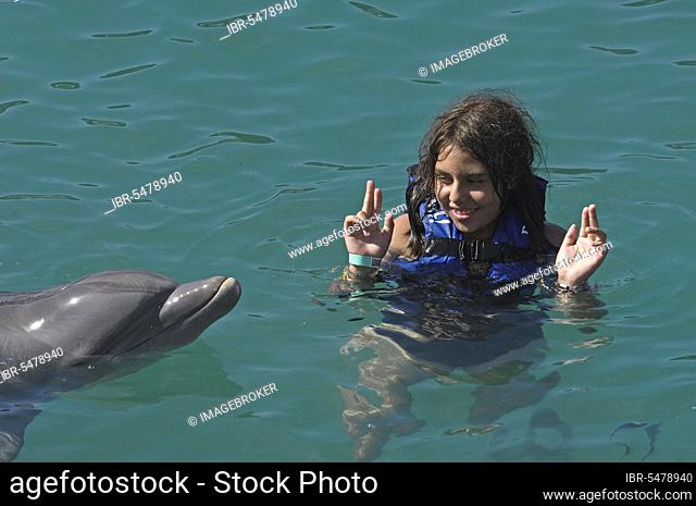 Girl with dolphin, Yucatan, swimming dolphins, dolphin, Xcaret Eco Park, near Playa del Carmen, Riviera Maya, Quintana Roo, Yucatan, Mexico, Central America