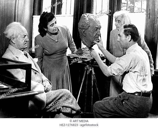 Arno Breker, German sculptor, working on a bust of Gerhart Hauptmann, 26 October 1942. The work of Breker was popular with several leading Nazis and Hitler in...