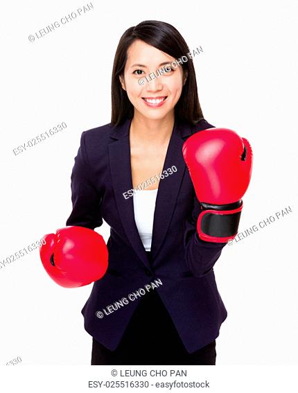 Asian businesswoman with boxing gloves for cheerup gesture