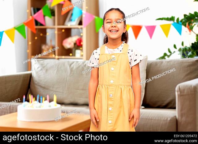 smiling little girl at birthday party at home