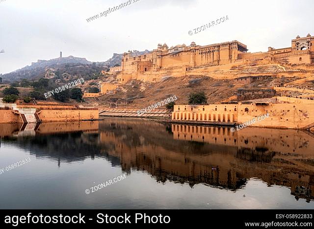 Amer fort or amber fort viewed from across the lake. Famous tourist landmark in Jaipur, India