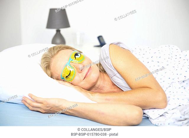 Woman wearing a sleep mask