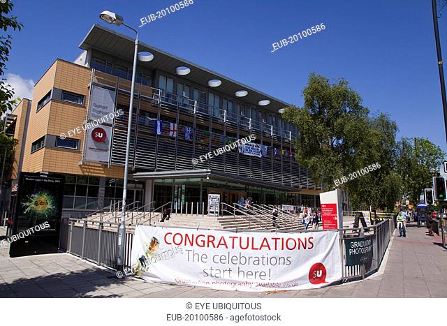 University Road Exterior of the Queens University Students Union building with graduation congratulations banner