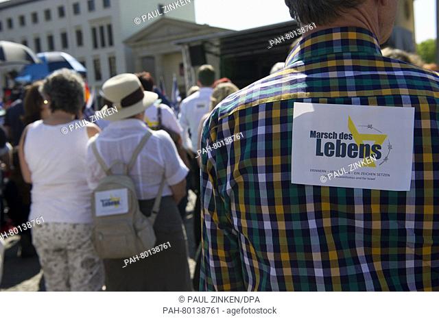 'March of the Living' can be read on a sticker on man's shirt on Pariser Platz in Berlin, Germany, 05 May 2016. The 'March of the Living' event for Holocaust...