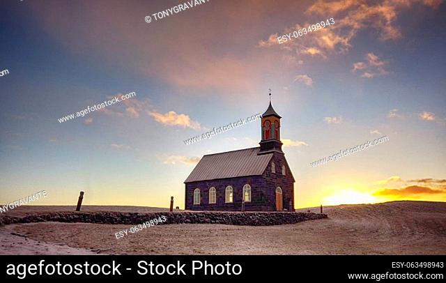 Hvalsneskirkja church located near the village of Sandgerdi in Iceland in winter at sunset