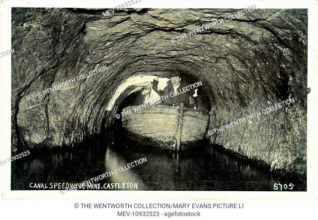 Underground Canal & Boat, Speedwell Lead/Blue John Mine, Castleton, near Chapel-on-the-Frith, Derbyshire, England. Showing men pushing the boat along by their...