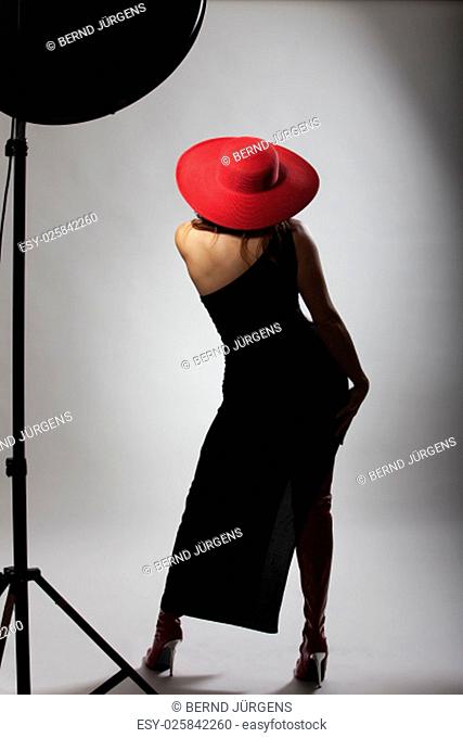 woman with a red hat from behind