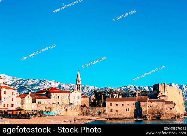 The Old Town of Budva, mountains covered with snow, Montenegro