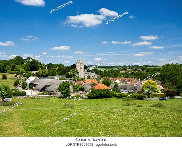 England, Wiltshire, Aldbourne. View over the village of Aldbourne dominated by the church of Saint Michael, a medieval and a Grade I listed building dating back...