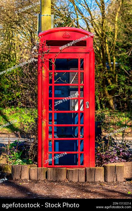 Near Flixton, Suffolk, England, UK - April 05, 2018: A derelict telephone booth