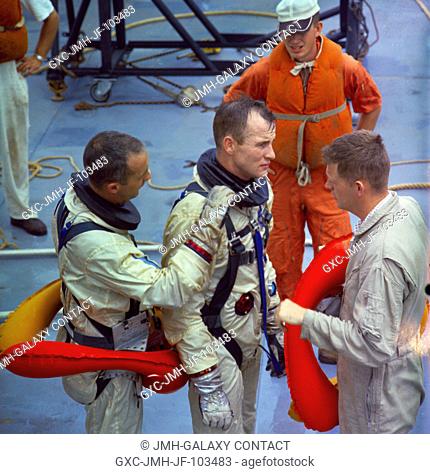The Gemini-Titan 4 prime crew is shown aboard the NASA Motor Vessel Retriever in the Gulf of Mexico suiting up for water egress training